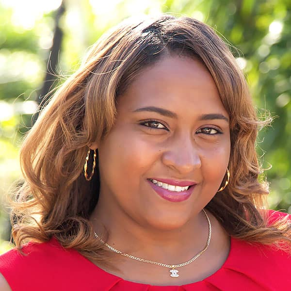 Tiffany Swift Belize Real Estate Agent Portrait Red Dress