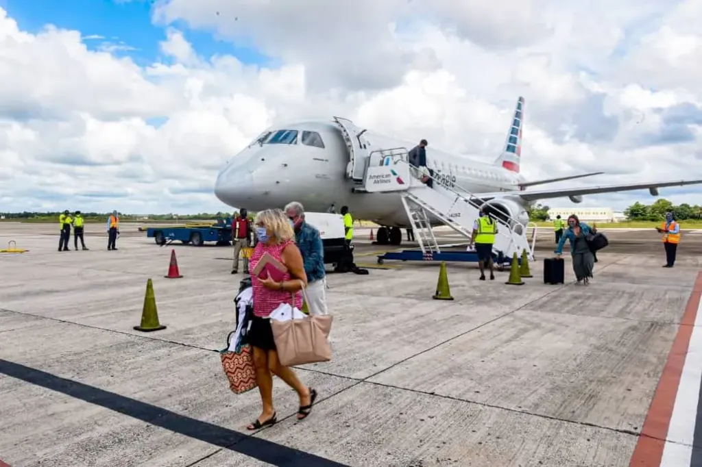belize philip goldson international airport open post coronavirus web Travelers getting off first flight to Belize post covid
