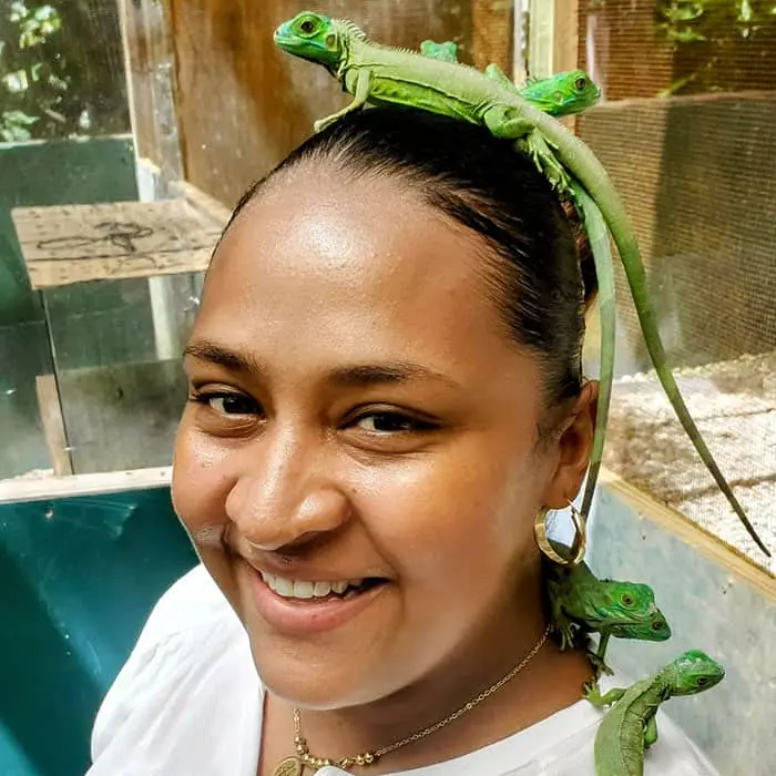 belize in summer ,  Tiffany Swift portait with an Iguana on her head